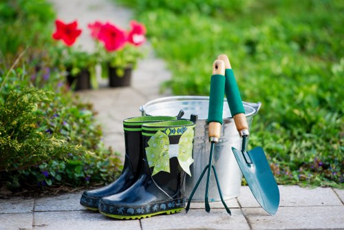 Close-up of pressure washer nozzle and cleaned paving